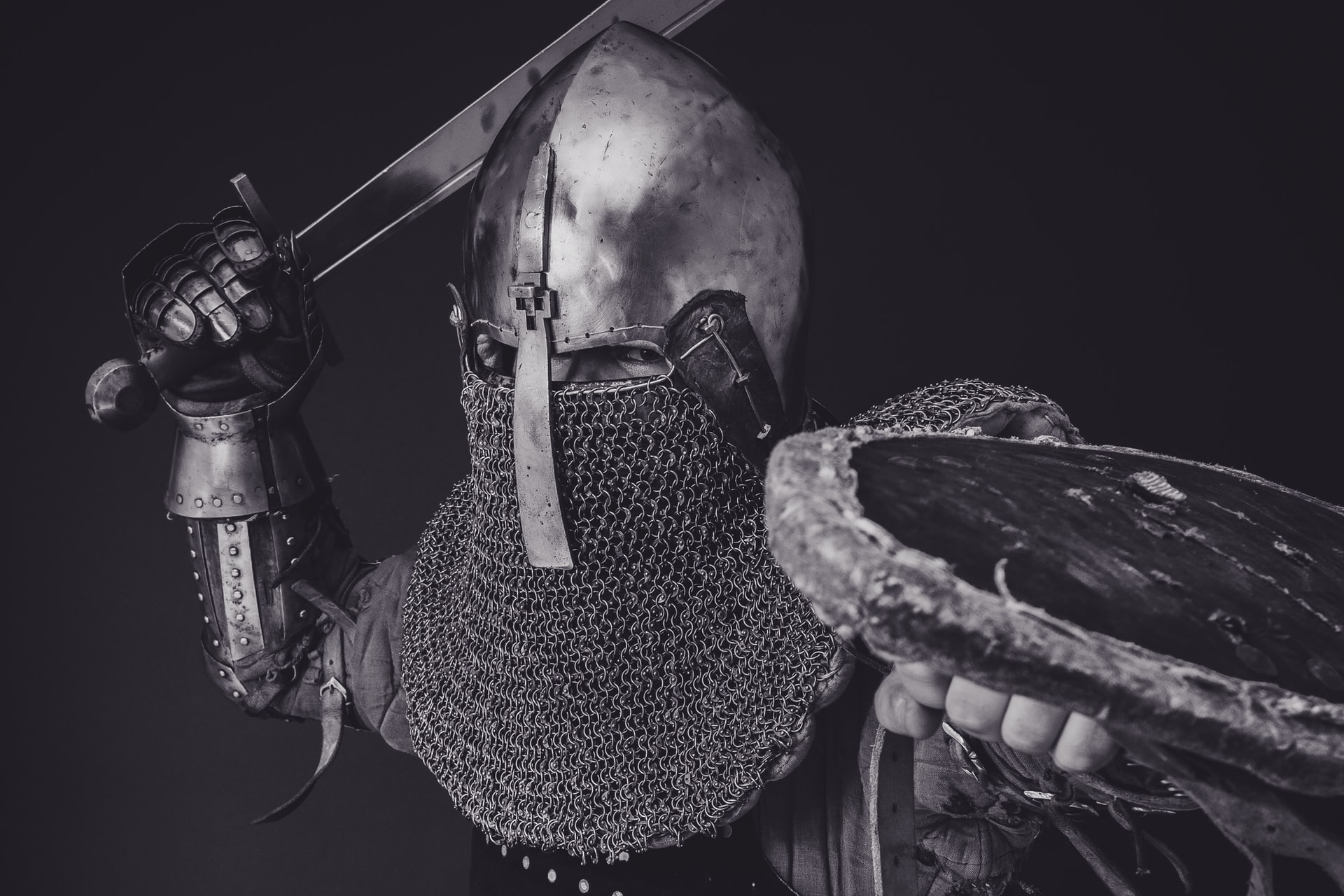 A knight wearing chainmail armor looking super angry
